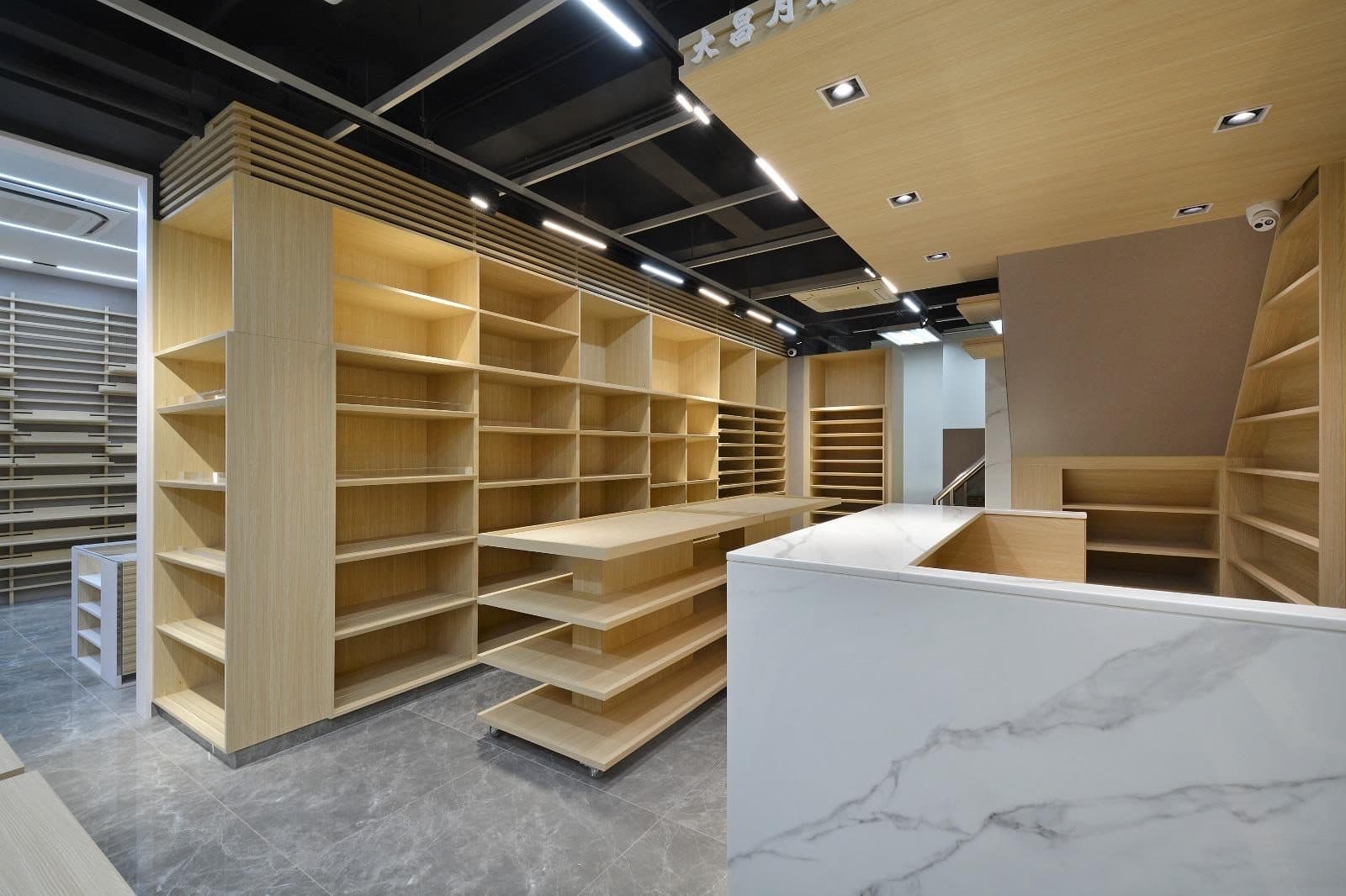 Tai Cheong Calendar Shop — main black-ceiling showroom, completed showcase