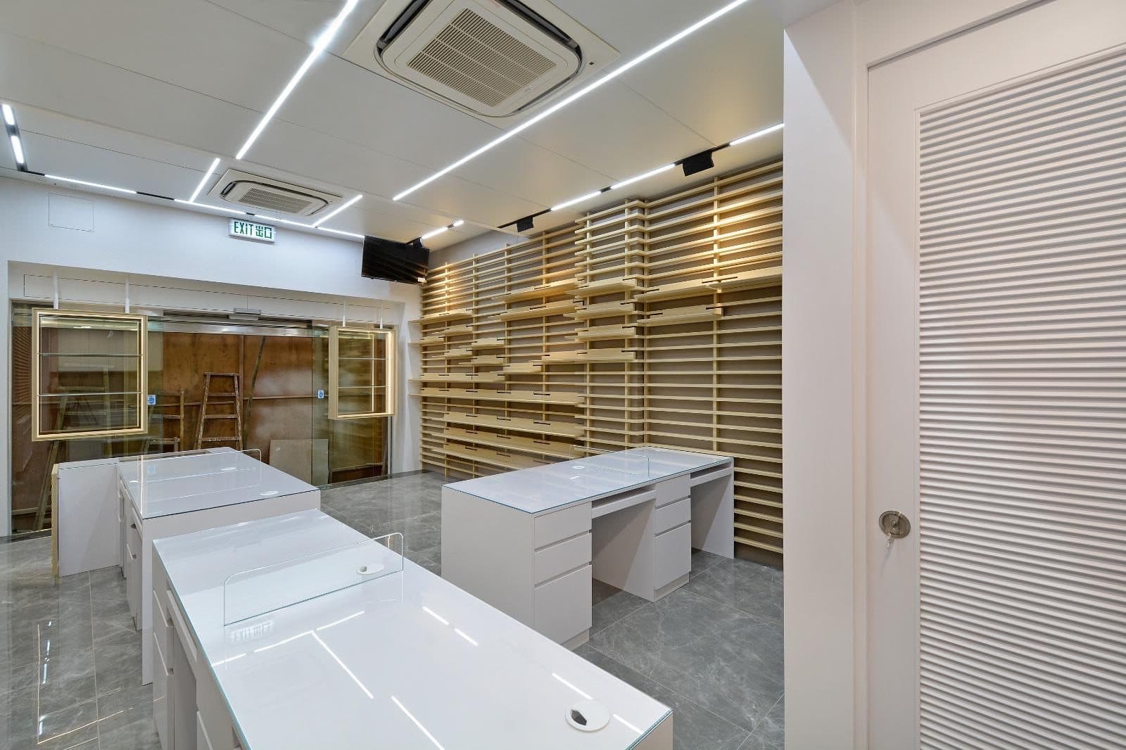 Tai Cheong Calendar Shop — white-ceiling counter room, completed showcase