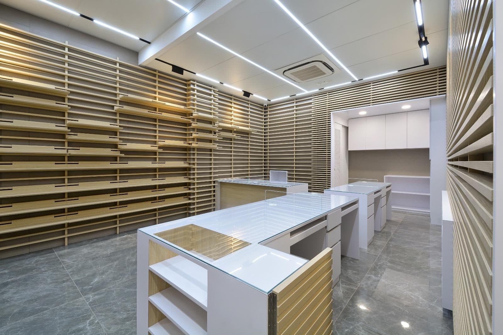 Tai Cheong Calendar Shop — white-ceiling retail room, completed showcase