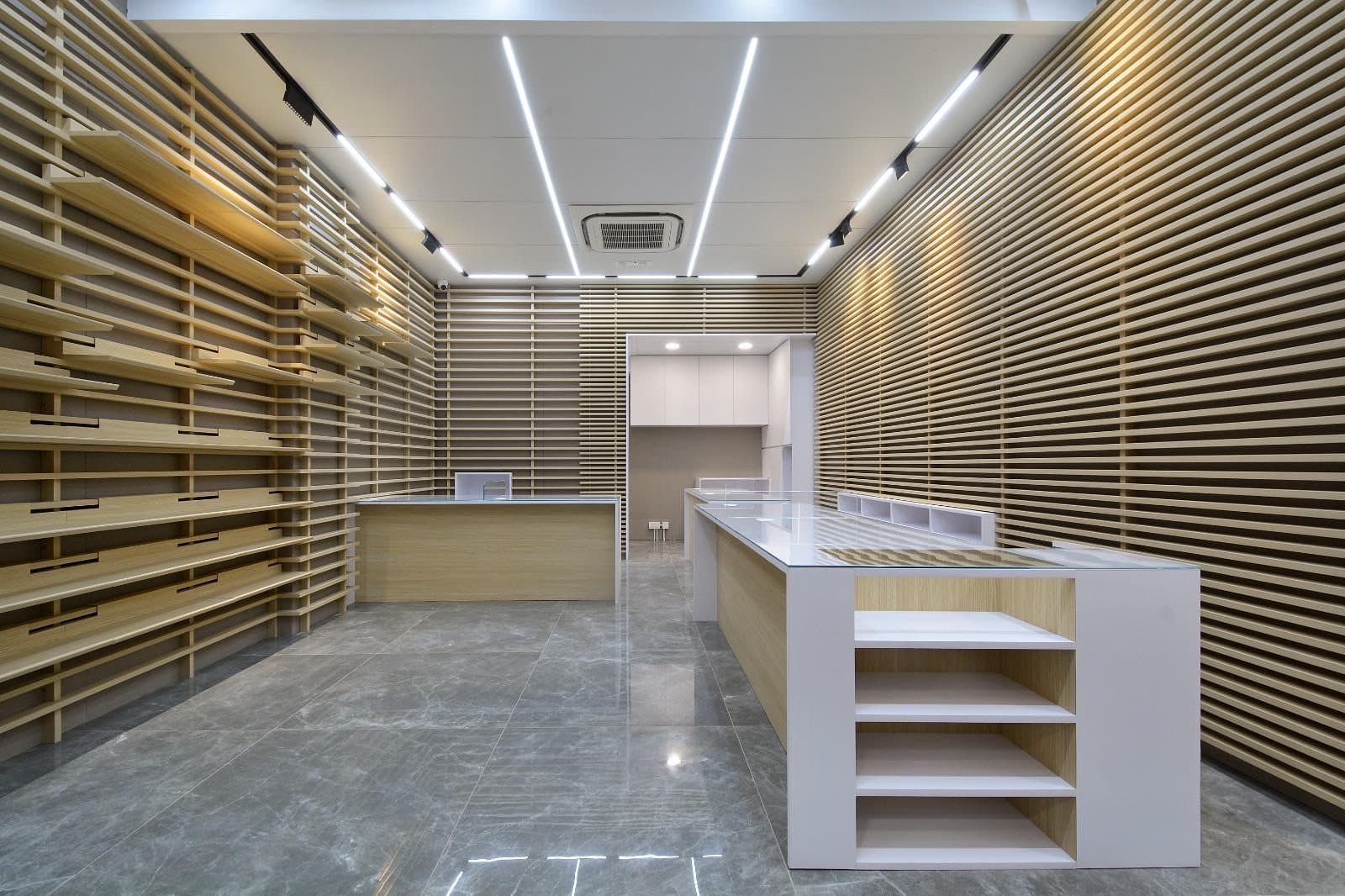 Tai Cheong Calendar Shop — white-ceiling retail room, completed showcase