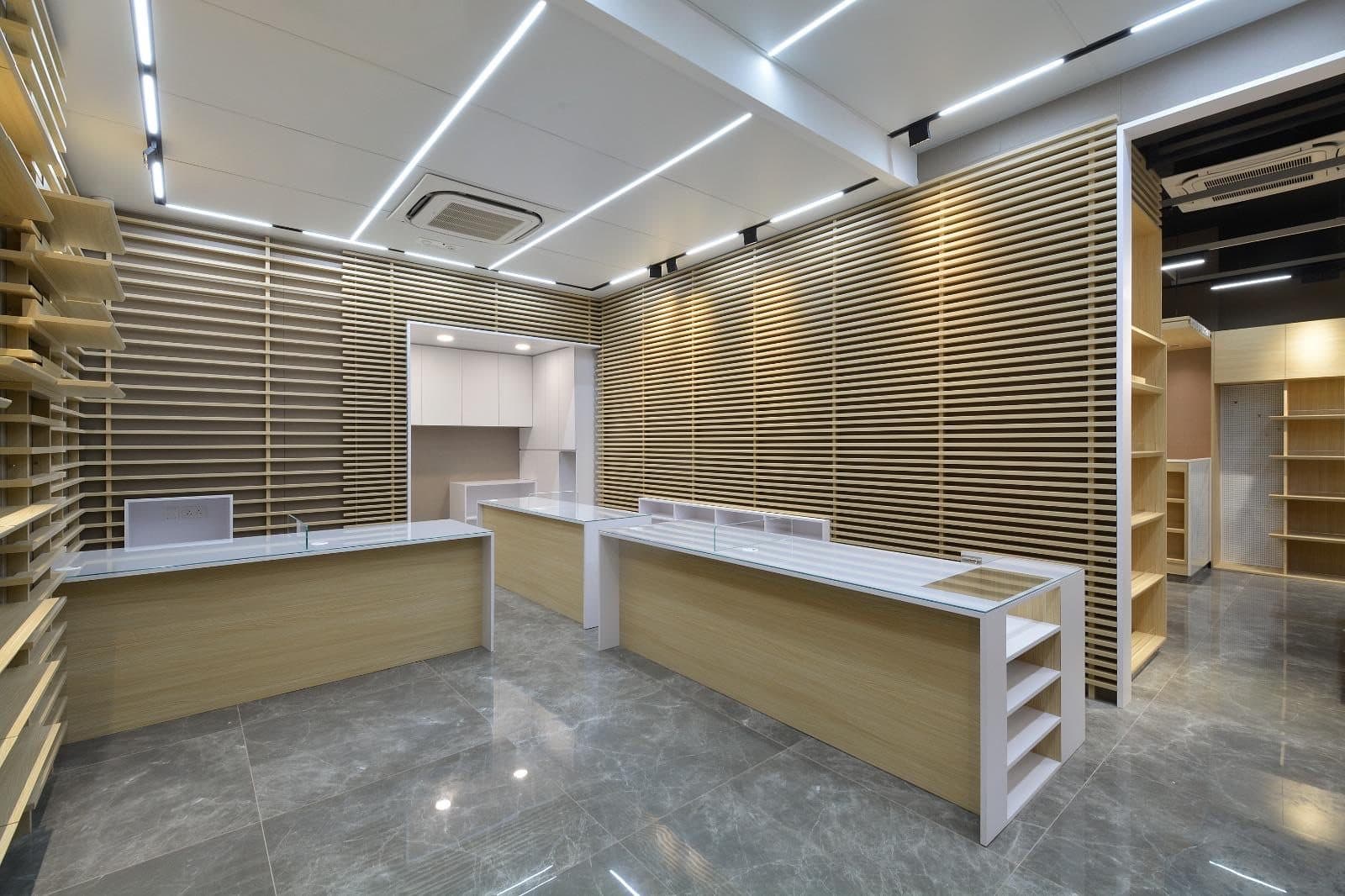 Tai Cheong Calendar Shop — white-ceiling front room, completed showcase