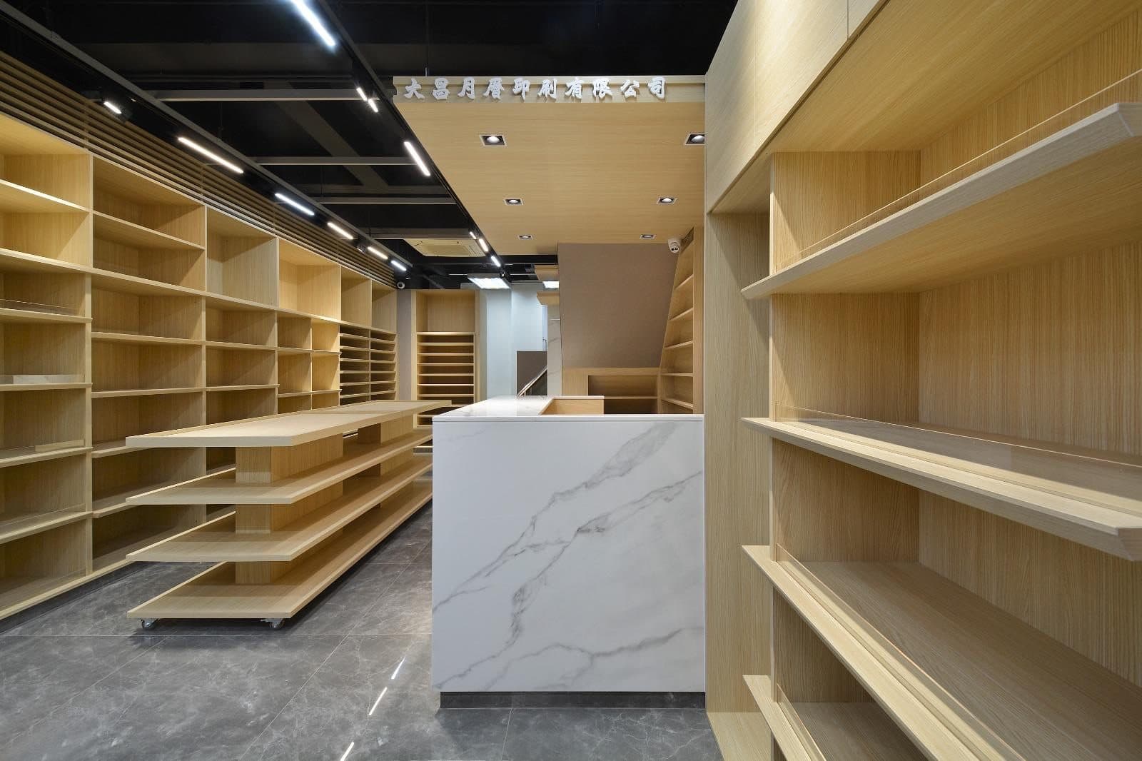 Tai Cheong Calendar Shop — marble counter zone, completed showcase