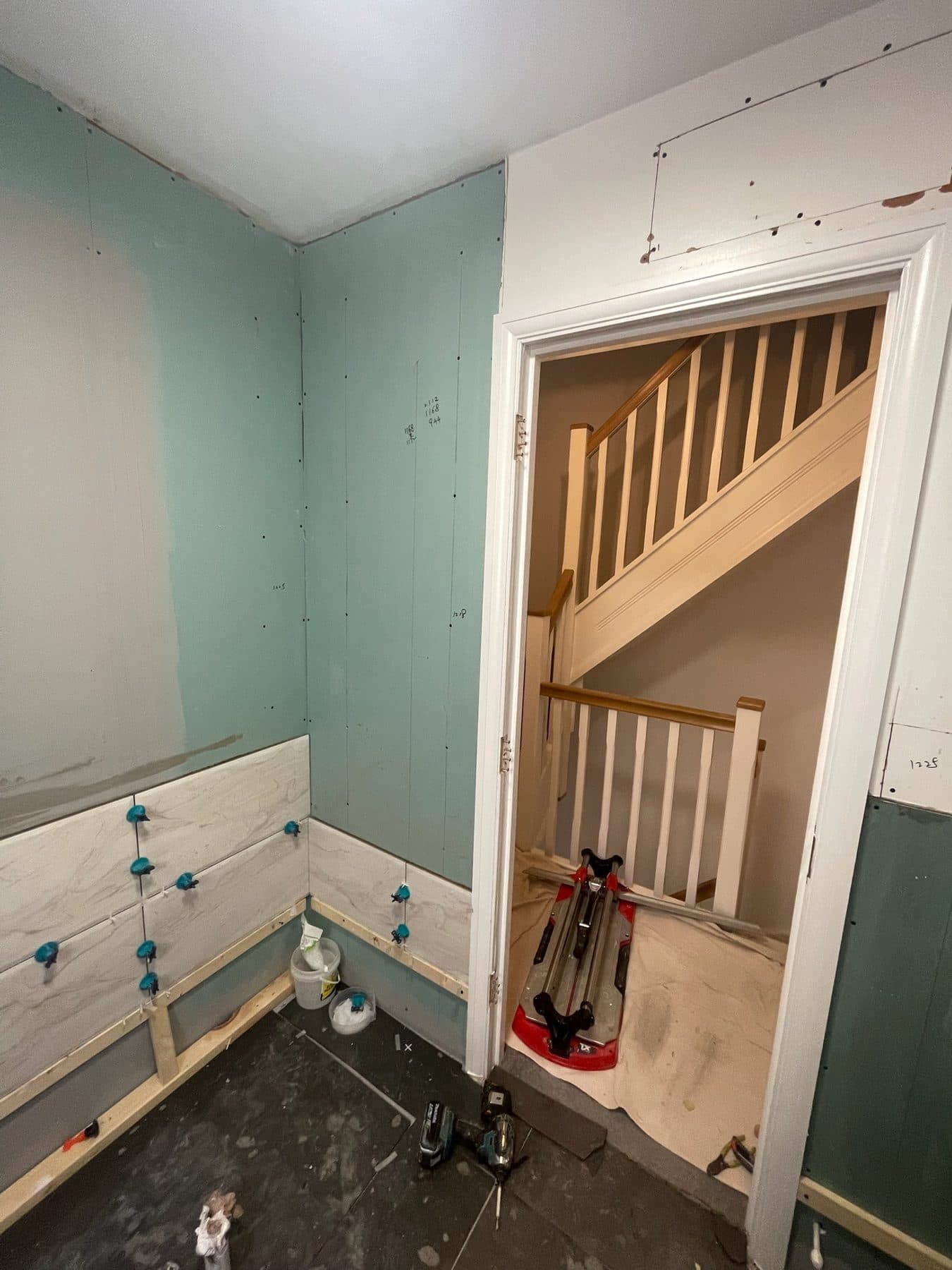 B5 — Bathroom doorway tiling, construction progress