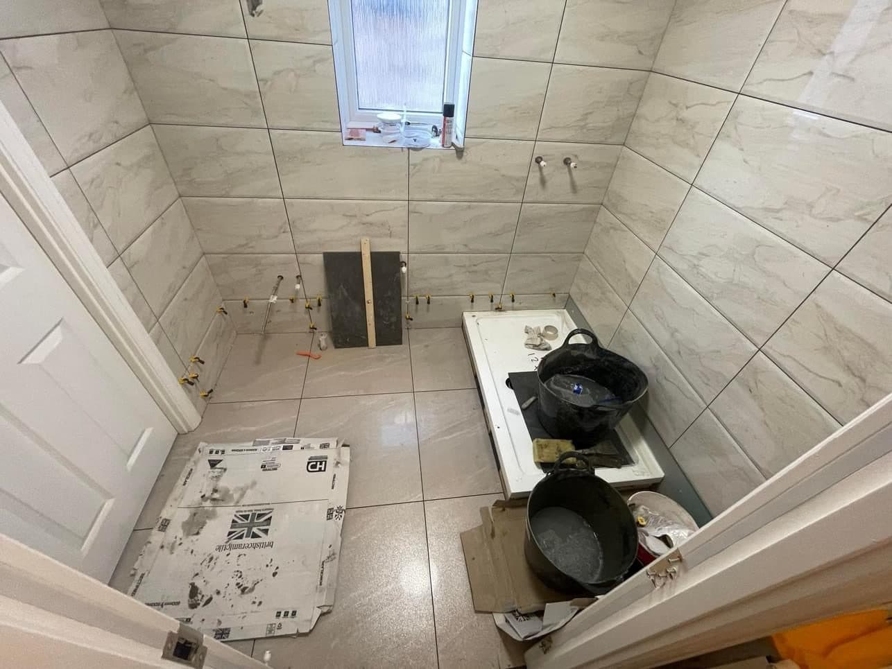 B5 — Bathroom floor and wall tiling, construction progress