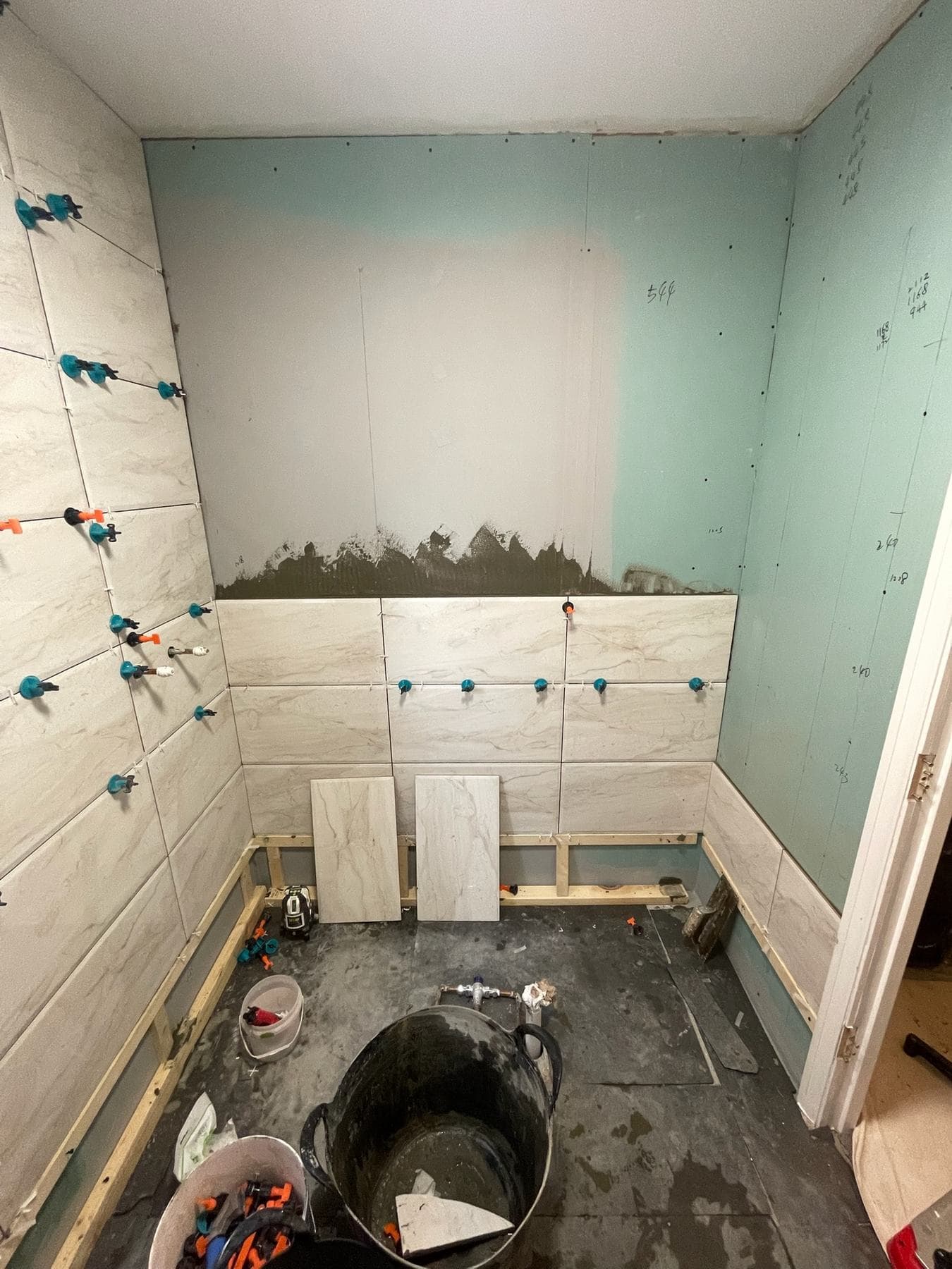 B5 — Bathroom side-wall tiling, construction progress
