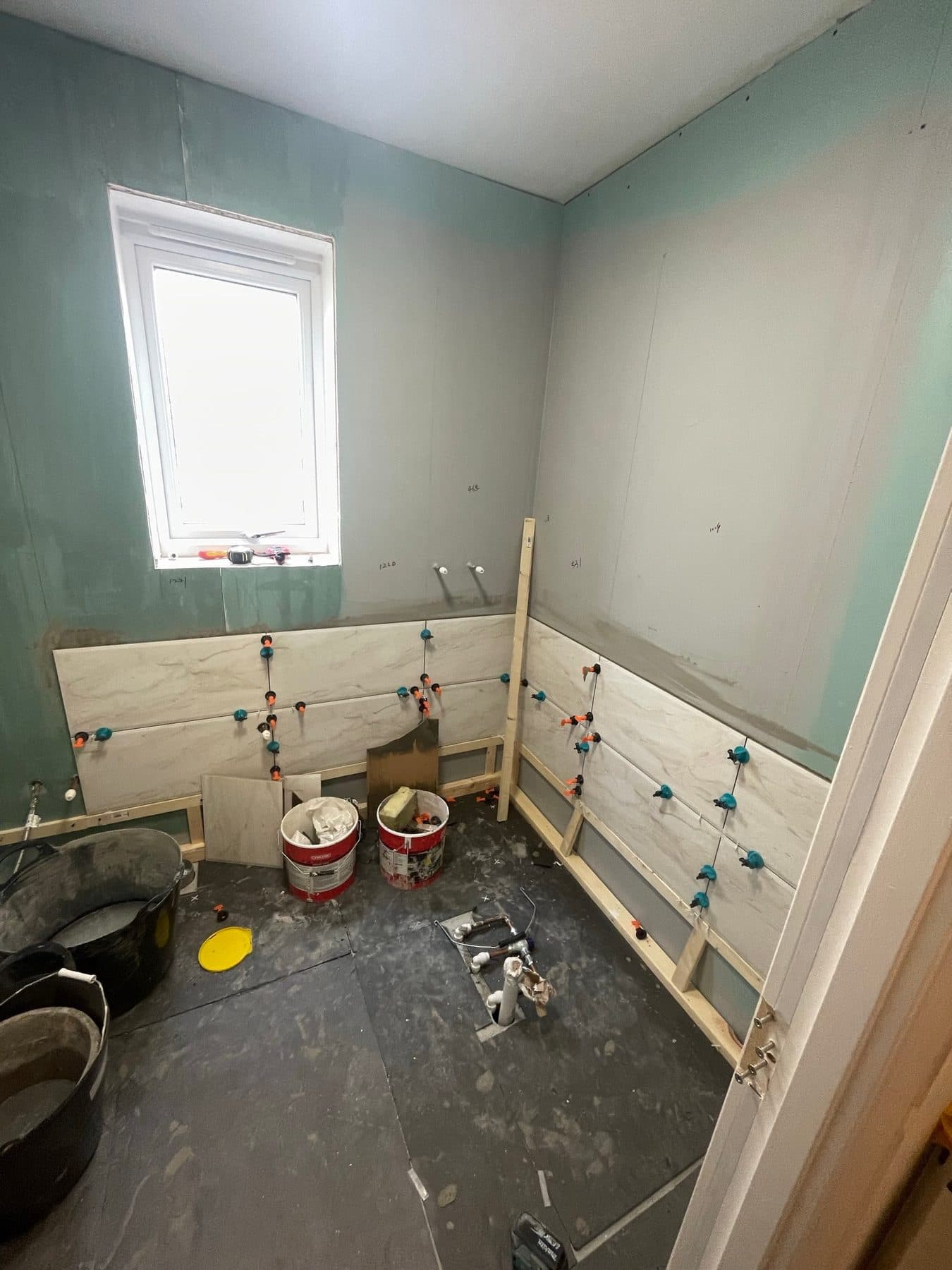 B5 — Bathroom wall tiling, construction progress