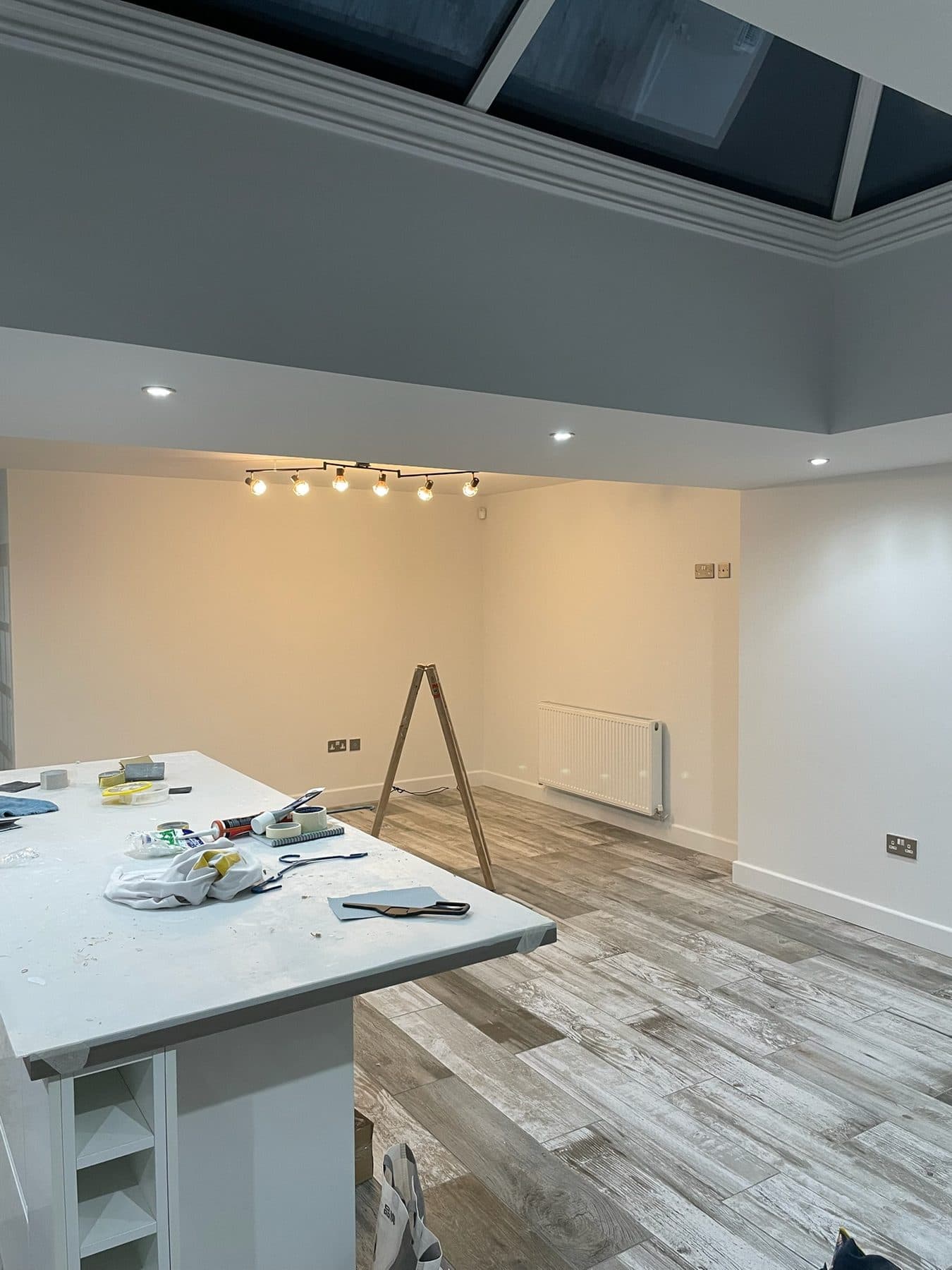 B90 King — Completed open-plan kitchen and dining area, construction progress